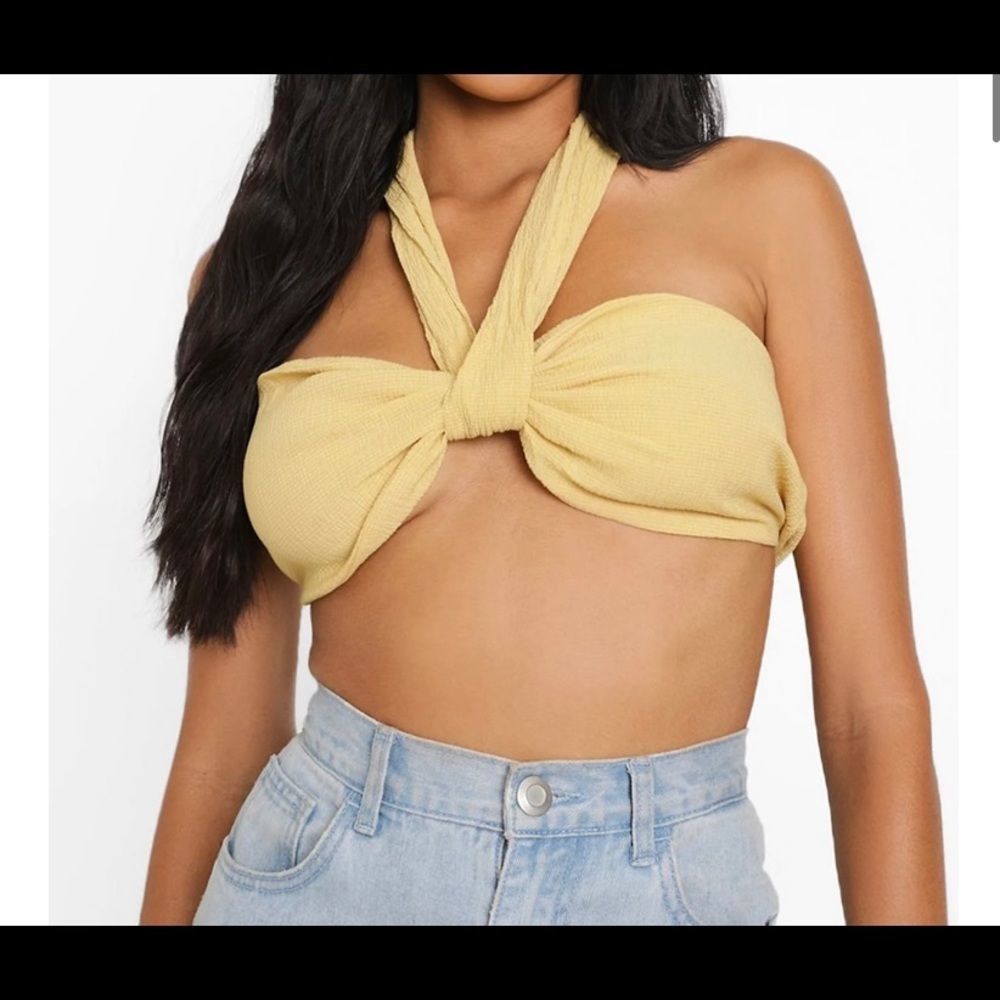 A yellow sleeveless, backless garment with serious sex appeal.